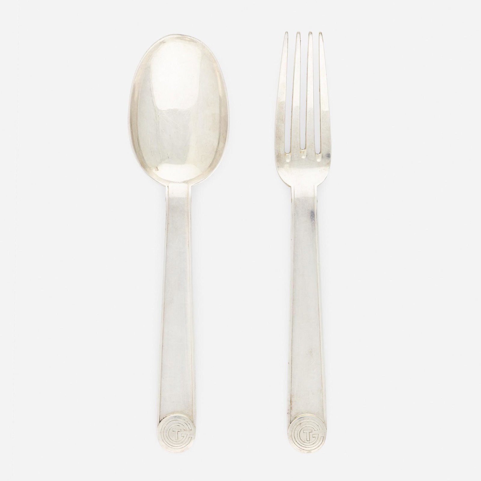 Jean-Emile Puiforcat, Normandie dinner fork and spoon: Jean-Emile Puiforcat Normandie dinner fork and spoon France, 1935 silver plate 8 h in (20 cm) This pattern was designed for the luxury ocean liner S.S. Normandie, which was built in Saint-Nazaire,