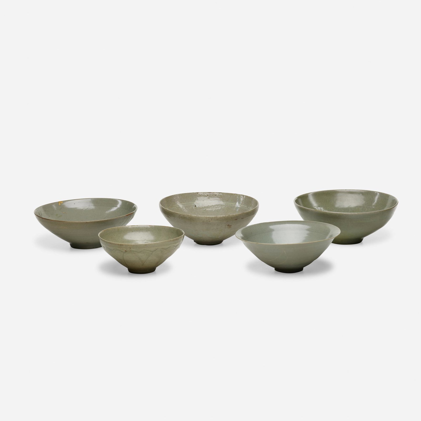 Chinese and Southeast Asian, celadon bowls: Chinese and Southeast Asian celadon bowls, collection of five glazed earthenware please note: This work is located at, and will ship from, Rago in Lambertville, New Jersey.