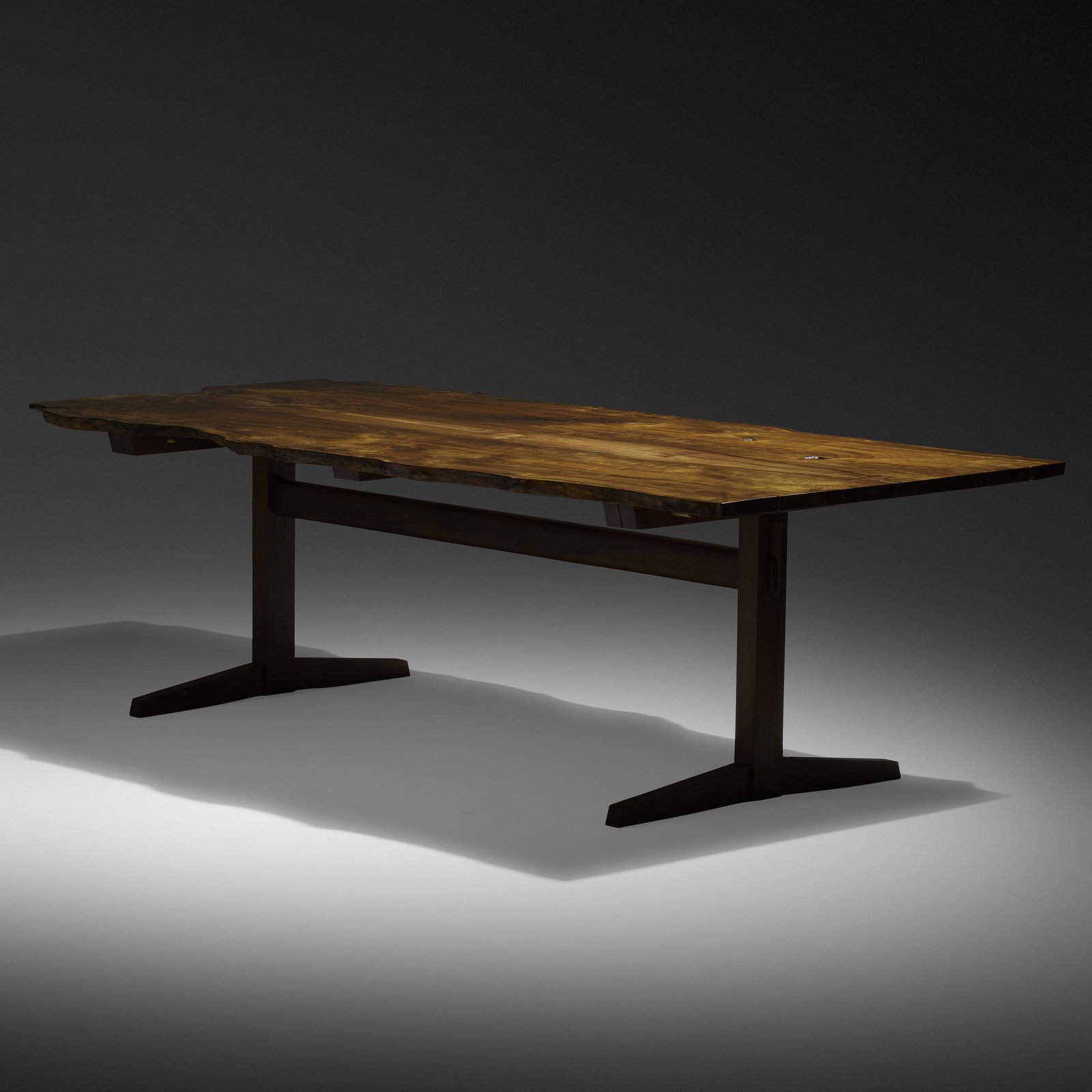Mira Nakashima, Trestle dining table: Mira Nakashima Trestle dining table Nakashima StudioUSA, 2010myrtle burl, American black walnut, rosewood28.75 h × 96 w × 45 d in (73 × 244 × 114 cm) Table features