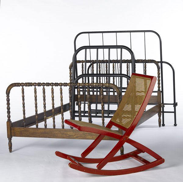 FURNITURE GROUP Includes three bed frames, etc.: FURNITURE GROUP Includes three bed frames, one spool and two black iron, together with a red lacquer caned rocking chair marked Made in Italy. Rocker: 38'' x 21'' x 36''