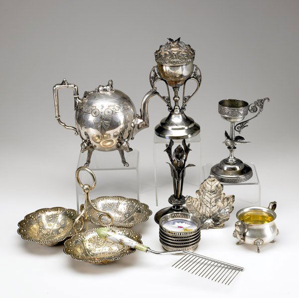 SILVERPLATE 21 pieces, 19th/20th C.: SILVERPLATE 21 pieces, 19th/20th C. Two epergnes, epergne stand, teapot, lighter, ashtray, coasters, porcelain-handled cake comb and fruit knives.