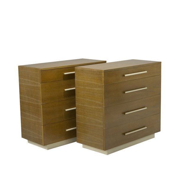 GILBERT ROHDE Pair of four-drawer chests: GILBERT ROHDE / HERMAN MILLER Pair of four-drawer limed oak chests with leatherette-covered plinth bases. One has Herman Miller foil label, both have stenciled numbers. 38'' x 40'' x 19''