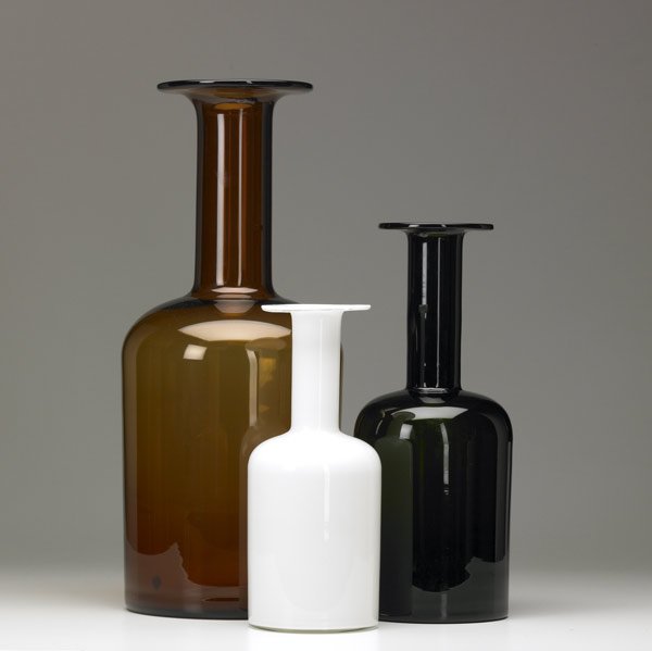 OTTO BRAUER Three blown glass Gulvase vases: OTTO BRAUER / KASTRUP-HOLMEGAARD Three blown glass Gulvase bottle-shaped vases in amber, bottle green and white cased glass, ca. 1965-75. Kastrup-Holmegaard labels to two larger. Largest: 19 3/4'' x 8