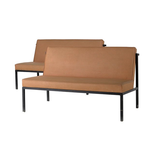FLORENCE KNOLL / KNOLL Pair of armless settees: FLORENCE KNOLL / KNOLL Pair of armless settees upholstered in coral vinyl on black enameled metal frames. Knoll International label to one. 29 1/2'' x 48'' x 27 1/2''