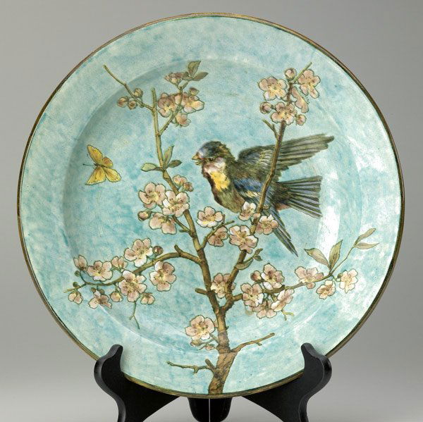 JOHN BENNETT Charger: JOHN BENNETT Charger beautifully painted with a bird on a cherry blossom branch, c. 1877. 1/4'' chip to center from firing, light wear, several minor kiln kisses along the rim. Signed J. BENNETT 101 L