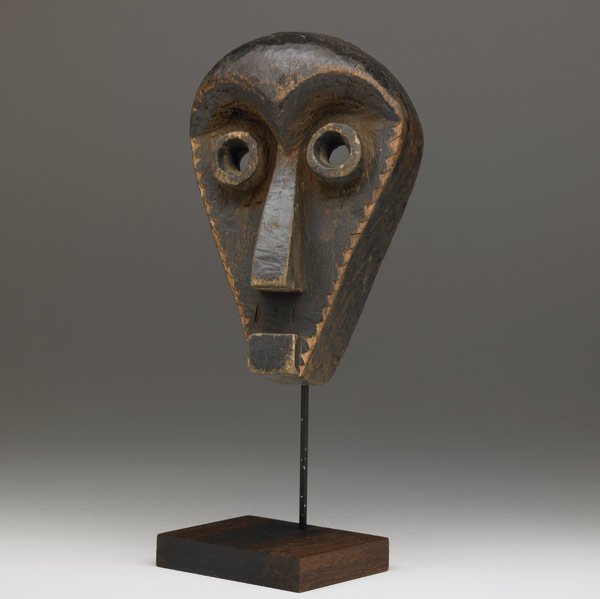 PENDE MUNYANGI MASK, ZAIRE: PENDE MUNYANGI MASK, ZAIRE Carved wood Munyangi with strong geometric features, early to mid-20th c. Used in performances associated with youthful energy. (Provenance: Scott McCue collection, Californ