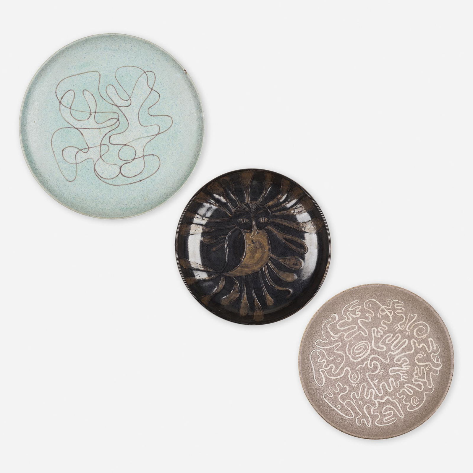 Edwin and Mary Scheier, chargers, collection of three: Edwin and Mary Scheier chargers, collection of three USA, 1945-63glazed stoneware1.25 h × 12.25 dia in (3 × 31 cm) Incised signature to underside of each example 'Scheier'. Dated to u