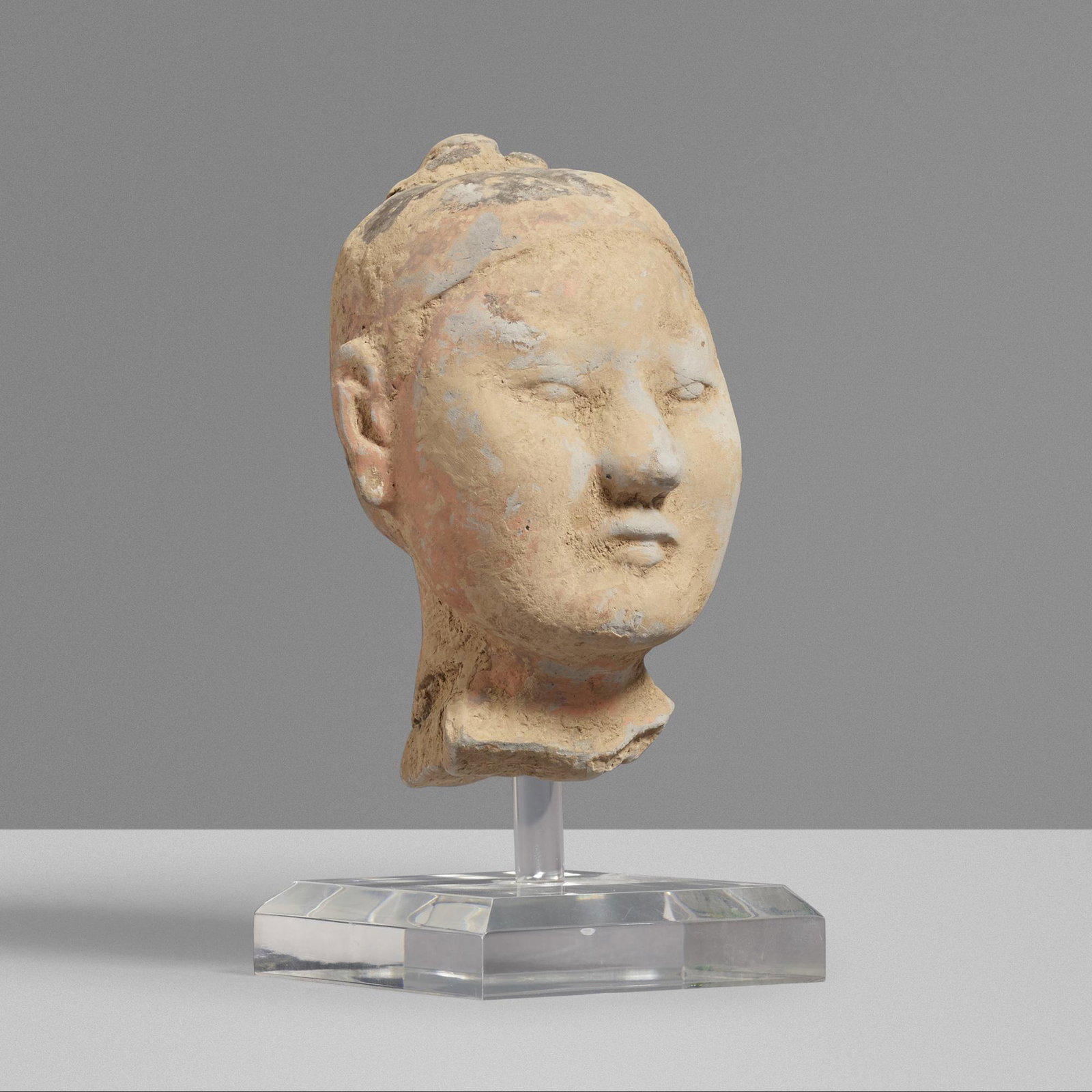 Chinese, Han Dynasty head of a soldier: Chinese Han Dynasty head of a soldier c. 110 BCE earthenware 4.5 h × 3 w × 3 d in (11 × 8 × 8 cm) Sold with stand. please note: this item will preview and ship from Chicago.