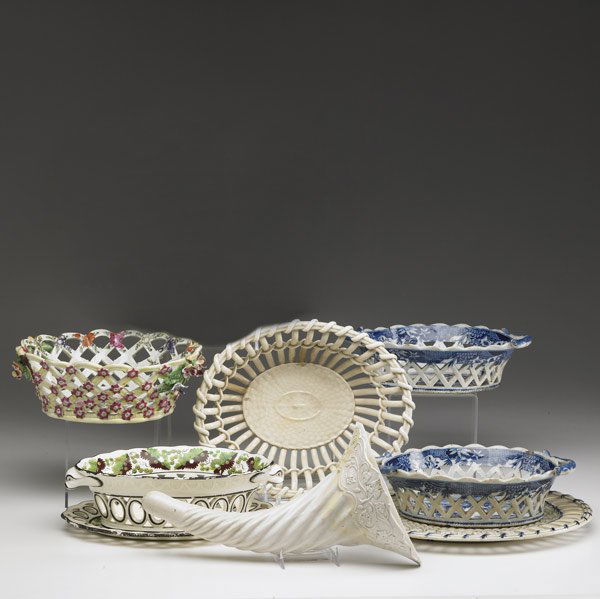 ENGLISH CERAMICS Eight pieces: ENGLISH CERAMICS Eight pieces include Spode reticulated basket with underplate, salt-glaze cornucopia, pair of Staffordshire reticulated baskets (one repaired), Wedgwood-type basket and mismatched und