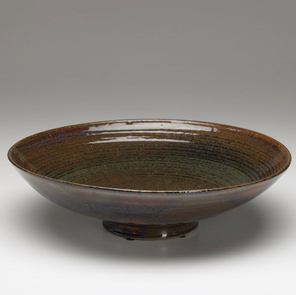 EDWIN AND MARY SCHEIER Early Large Flaring Bowl: EDWIN AND MARY SCHEIER Early, large flaring footed bowl covered in glossy brown glaze, 1949. (Provenance: Lotti Jacobi.) Signed Scheier 49. 4'' x 14'' dia.
