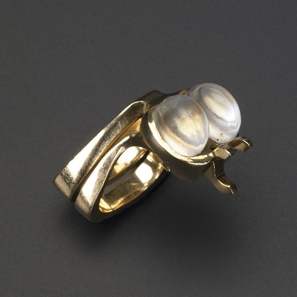 ALBERT PALEY Ring Set: ALBERT PALEY Rare and early interlocking ring set in yellow gold with two moonstone cabochons, 1968.