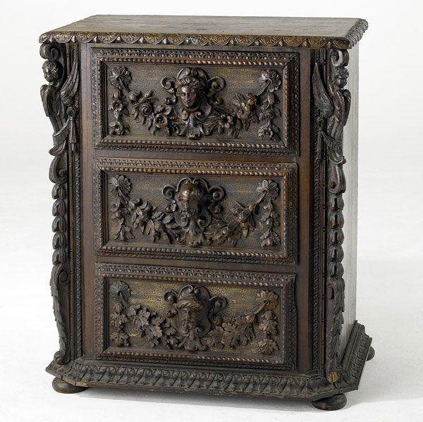 RENAISSANCE REVIVAL Carved three-drawer chest: RENAISSANCE REVIVAL Elaborately carved three-drawer chest with figural drawer pulls. 38'' x 32'' x 20''