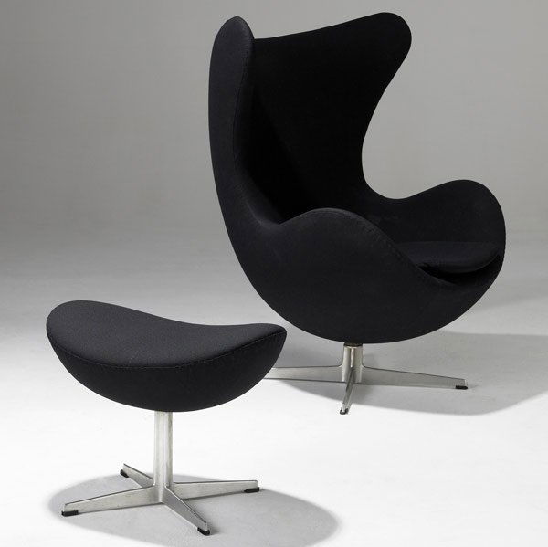 ARNE JACOBSEN Egg chair and matching ottoman: ARNE JACOBSEN Egg chair and ottoman upholstered in black fabric on aluminum frame. Chair: 42'' x 35'' x 30''; ottoman: 17 1/2'' x 22'' x 16''