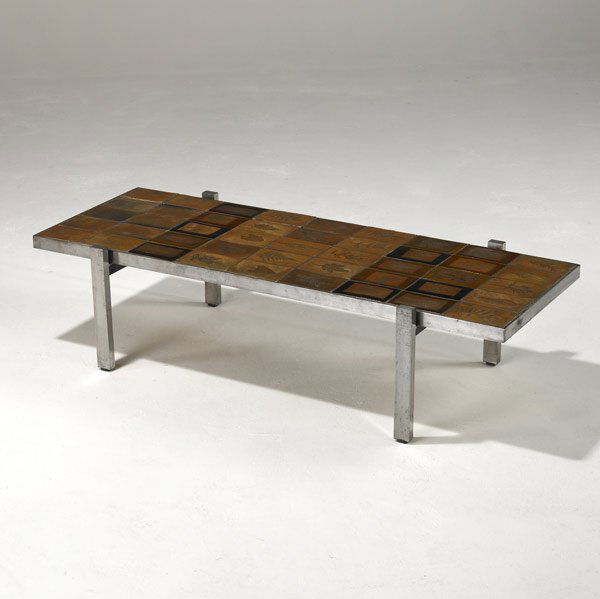 ROGER CAPRON Tile-top coffee table: ROGER CAPRON Polished steel coffee table with tile top, the ceramic tiles with impressed leaf designs. Stamped Capron Vallauris France. 11 1/2'' x 45'' x 18 1/2''
