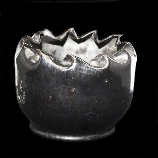 GEORGE OHR Black vase with folded rim: GEORGE OHR Vessel with crisply folded rim, covered in mottled gunmetal glaze. Script signature 3'' x 4 1/4''.