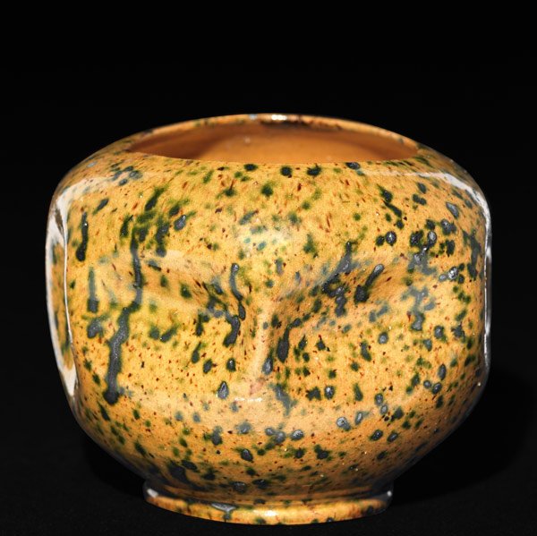 GEORGE OHR Dimpled orange and green vase: GEORGE OHR Closed-in spherical vessel with vertical and horizontal dimples, covered in gunmetal green-speckled amber glaze. Stamped G.OHR Biloxi, Miss. 3'' x 4''