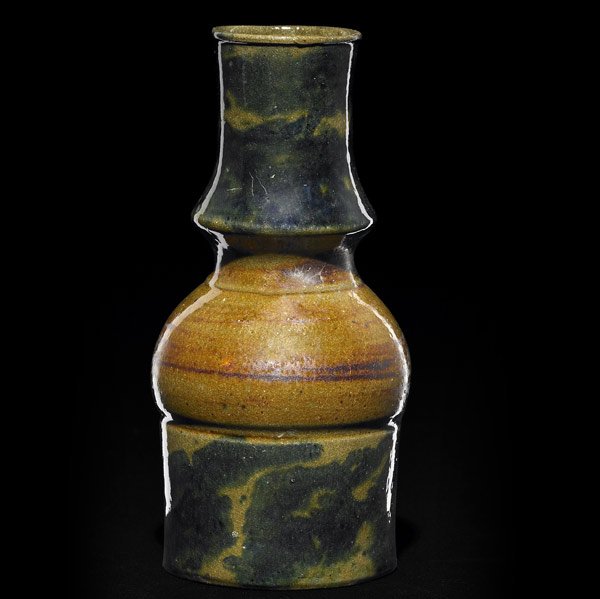 GEORGE OHR Totemic bottle: GEORGE OHR Totemic bottle covered in sponged-on teal blue glaze on amber ground, the middle with copperdust striations. Stamped G.E. OHR Biloxi, Miss. 7'' x 3 1/2''