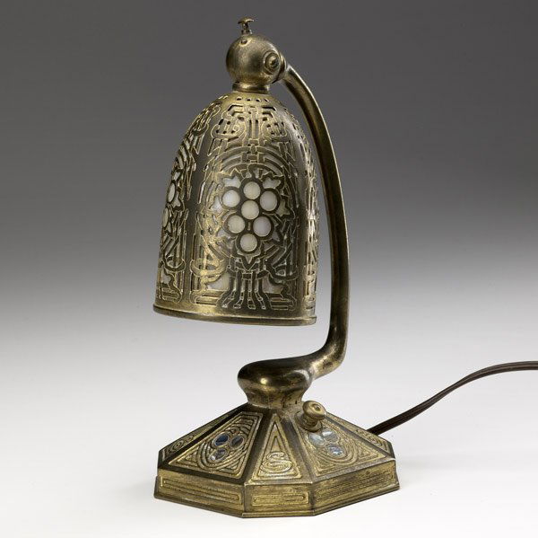 TIFFANY STUDIOS Abalone desk lamp: TIFFANY STUDIOS Gilt-bronze Abalone desk lamp with adjustable shade lined in caramel slag glass. Some wear to finish. TIFFANY STUDIOS NEW YORK 556. 9''