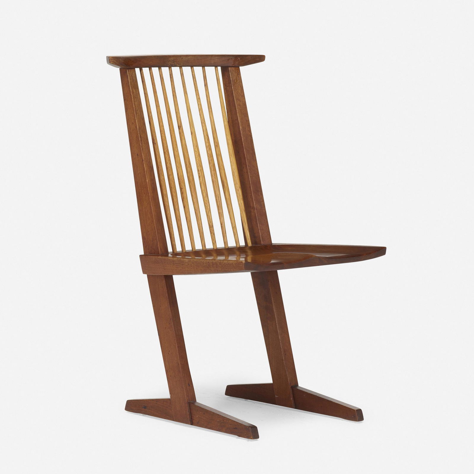 George Nakashima, Conoid chair: George Nakashima Conoid chair Nakashima StudioUSA, 1966American black walnut, hickory35 h × 20 w × 21 d in (89 × 51 × 53 cm) Sold with a digital copy of the original