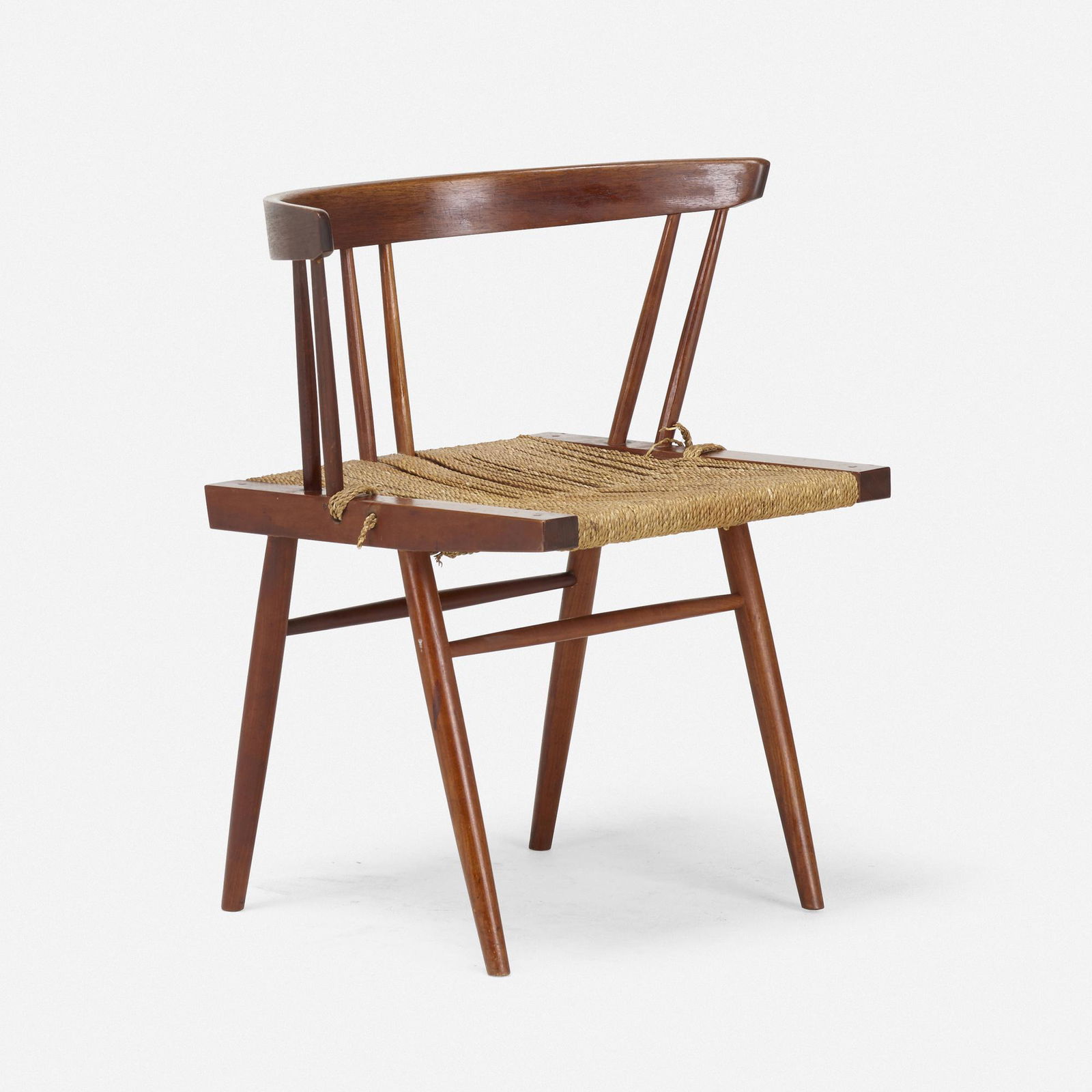George Nakashima, Grass-Seated chair: George Nakashima Grass-Seated chair Nakashima StudioUSAAmerican black walnut, sea grass cord27.5 h × 24 w × 18 d in (70 × 61 × 46 cm) Sold with a letter of authenticity from Mira Nakashima.