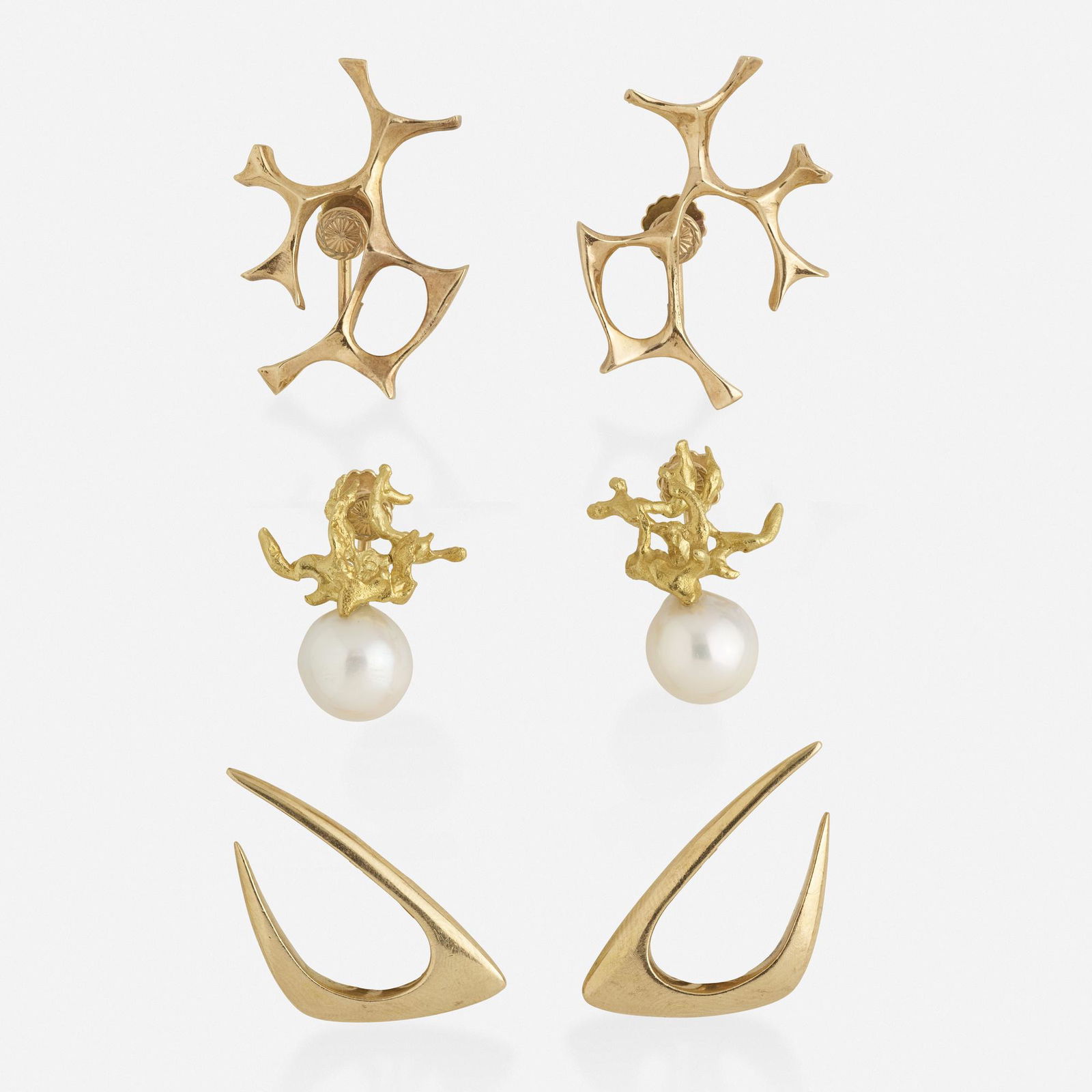 Three pairs of modernist gold earrings: Three pairs of modernist gold earrings Each of abstract gold, one set with cultured pearls 14k yellow gold Attributed to Ed Wiener Gross weight 20.8 dwts
