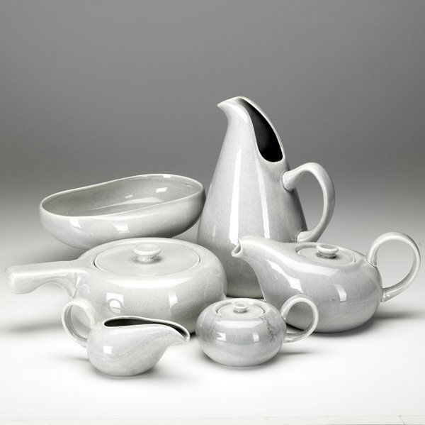 RUSSEL WRIGHT 'AMERICAN MODERN' DINNERWARE: RUSSEL WRIGHT 'AMERICAN MODERN' DINNERWARE Grouping includes pitcher, teapot, creamer & sugar, covered serving dish and oval serving dish, all in gray glaze. Chip to teapot. All marked Russell Wright