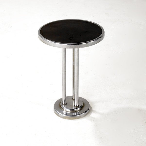 WOLFGANG HOFFMAN / HOWELL: WOLFGANG HOFFMAN / HOWELL Drink stand in chromed steel with black laminate inset top. Howell label. 18 1/2'' x 13 1/2'' dia.