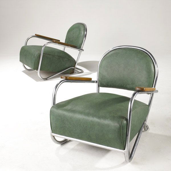 STYLE OF GILBERT ROHDE: STYLE OF GILBERT ROHDE Art Deco club chairs on tubular chrome frames upholstered in green leatherette, with solid walnut armrests. 26 1/2'' x 29'' x 29''