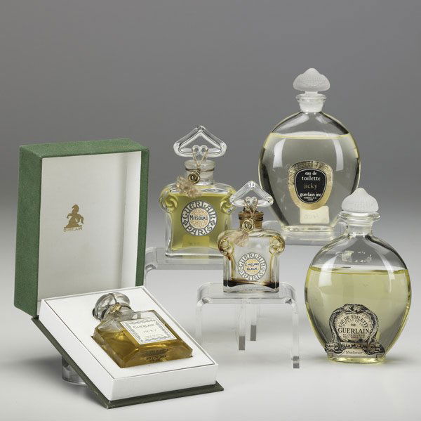 FIVE GUERLAIN PERFUMES: FIVE GUERLAIN PERFUMES Include 1 oz. 'Jicky' (1974) in original green presentation case, 'Jicky' eau de toilette (1975), 'L'Heure Bleu' (1973), 'Mitsouko' dummy and 'Shalimar' dummy. Tallest: 5''