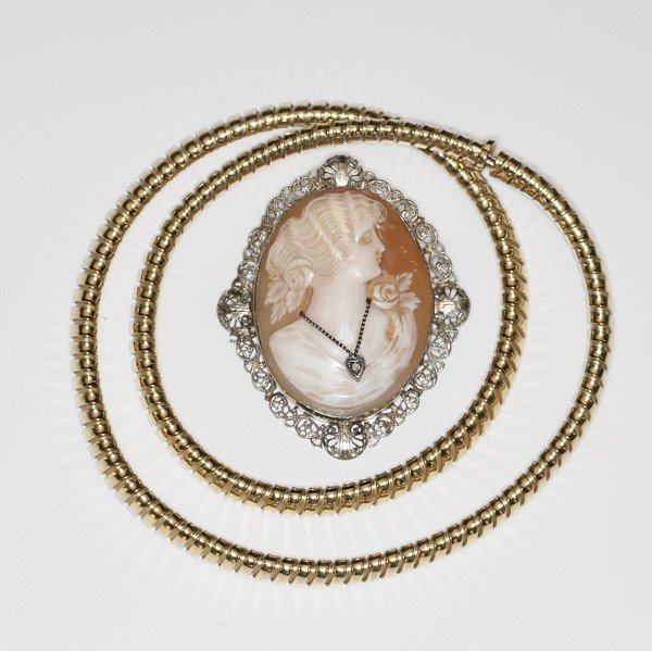 TIFFANY & CO. Gold gaspipe necklace : TIFFANY & CO. Gold gaspipe necklace and two cameo brooches. 18k necklace, marked Tiffany & Co., ca. 1985, 18 1/2'', 6mm x 4mm; shell cameo depicts woman with diamond necklace, 14k wg frame, 2'' x 1 5/