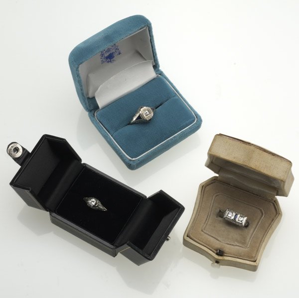 ART DECO DIAMOND RINGS : ART DECO DIAMOND RINGS Three filigree rings, 18k wg, ca. 1920. Two-stone by Belais with sapphire baguette; Belais solitaire; square set solitaire with triangular sapphires, .80 ct. TW. 8.8 gs. GW. Siz