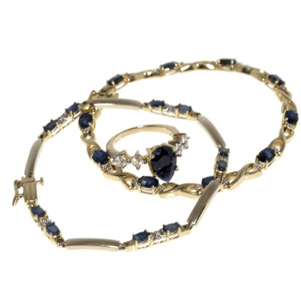 SAPPHIRE & DIAMOND JEWELRY: SAPPHIRE & DIAMOND JEWELRY Ring and two link bracelets, 14k yg. Ring centers pear shaped blue sapphire, approx. 2.50 cts., flanked by square faceted colorless sapphires and diamonds, size 7. Bracelets