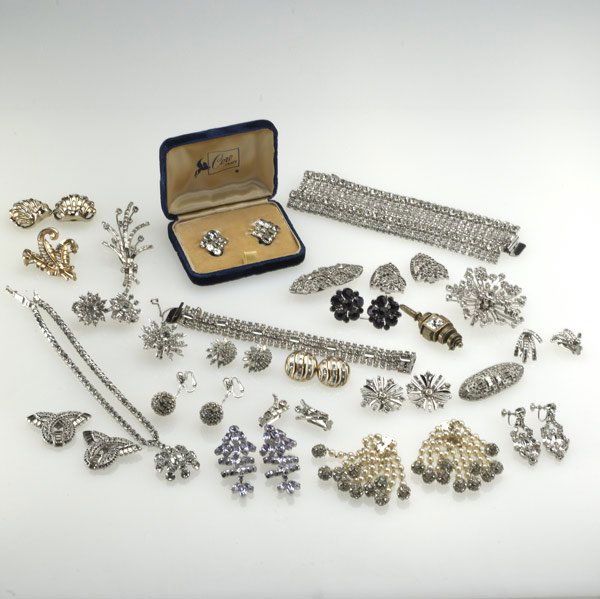 MID 20TH C. COSTUME JEWELRY: MID 20TH C. COSTUME JEWELRY Approximately twenty-four pieces with rhinestones or pastes, include bracelets, earrings, brooches and clips. Makers include Trifari, DiNicola, Coro Duette, Coro Craft, Aus
