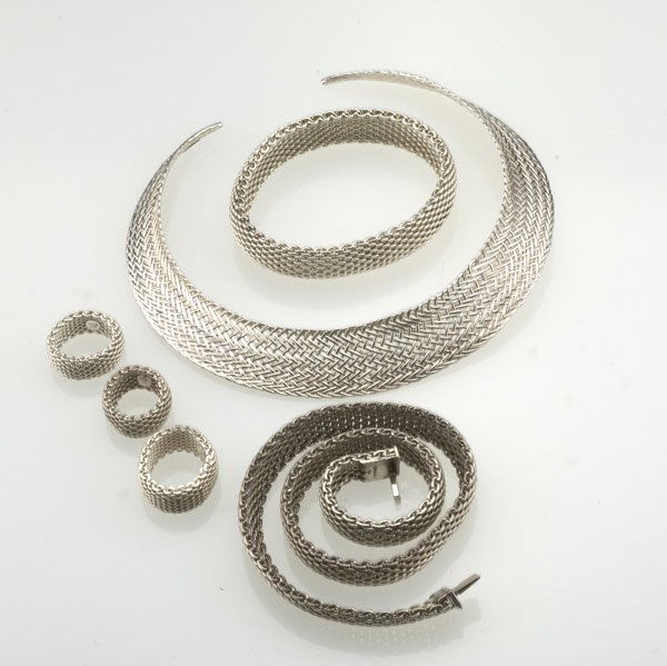 TIFFANY & CO. Somerset Mesh: TIFFANY & CO. Six pieces of silver Somerset Mesh jewelry: gorget, bracelet, 4 1/2''; necklace 17''; three rings, sizes 5-9 3/4. 223.5 gs. GW.