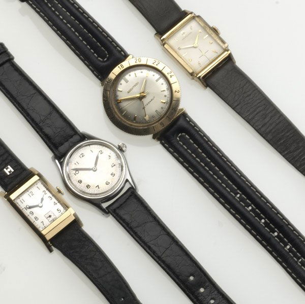 MEN'S WRISTWATCHES: MEN'S WRISTWATCHES Grouping of four includes Bulova Accutron Astronaut, waterproof, battery operated, 14k bezel ring, ca. 1970; Cord 15 jewel 18k gold back and bezel with black leather band; Hamilton