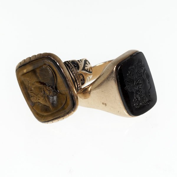 TWO GENTLEMAN'S RINGS: TWO GENTLEMAN'S RINGS 14k with intaglio carnelian, dished tiger's eye cameo, ca. 1880-1900. 16.2 gs. GW, sizes 9 and 11.