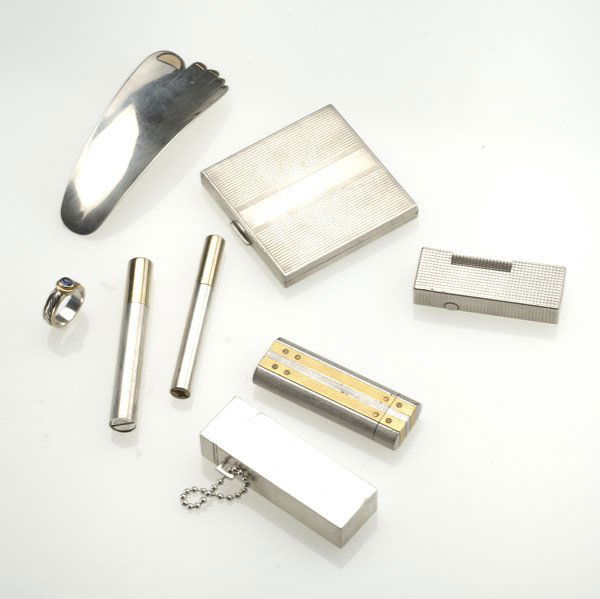 SMOKING ACCESSORIES, ETC.: SMOKING ACCESSORIES, ETC. Eight pieces include: Cartier lighter; 2 Gucci sterl. parcel gilt pen-form lighters, one unmarked; Dunhill lighter; Whimsical M&J Savitt sterl. and 14k shoehorn; Dunhill ster