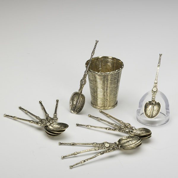 TIFFANY & CO. LONDON Twelve demitasse spoons: TIFFANY & CO. LONDON Twelve gilt silver demitasse spoons, ca. 1940, 4 1/8''. Together with gilt silver basket weave toothpick holder, ca. 1959, 2 1/4''. 7.13 OT.