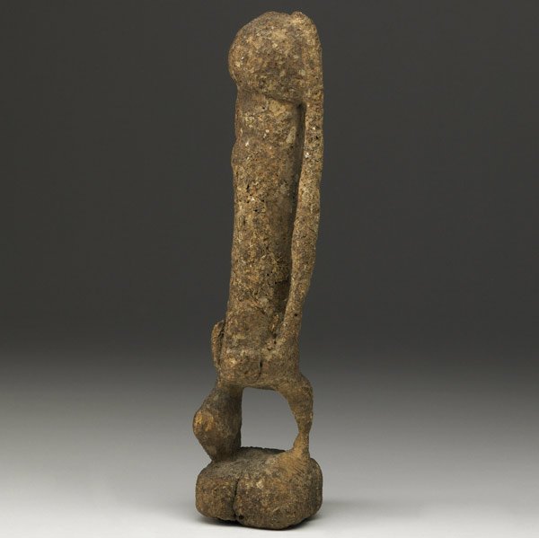 DOGON TELLUM ANCESTOR FETISH, MALI : DOGON TELLUM ANCESTOR FETISH, MALI Heavily incrusted shrine object with multiple layers of sacrificial matter, suggesting generations of ritual use, 18th-19th c. Figures of this type were traditionall