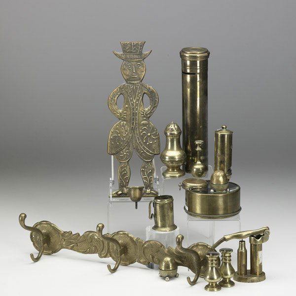 BRASS GROUPING Fourteen pieces: BRASS GROUPING Fourteen pieces include sanders, magnifier, pocket compass, seal, candle sconce, wall bracket, whistle, etc. Largest: 15 1/2'' x 5''