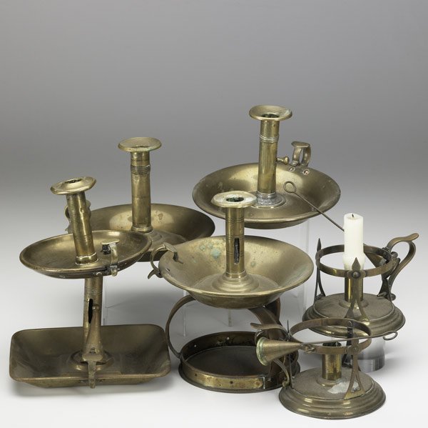 EIGHT ENGLISH BRASS CHAMBERSTICKS: EIGHT ENGLISH BRASS CHAMBERSTICKS In various sizes and styles, 19th C. Largest: 7'' x 6 1/4''