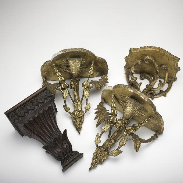 FOUR WALL BRACKETS: FOUR WALL BRACKETS Gilded pair, 18th C., (with damage) together with one gilded and one in mahogany, both 19th C. Largest: 11'' x 7'' x 6''