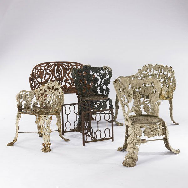 GARDEN FURNITURE Six wrought iron pieces: GARDEN FURNITURE Six wrought iron pieces with foliate designs include two settees, three chairs and a table, 20th C. Largest: 29 1/2'' x 36 1/2'' x 17''