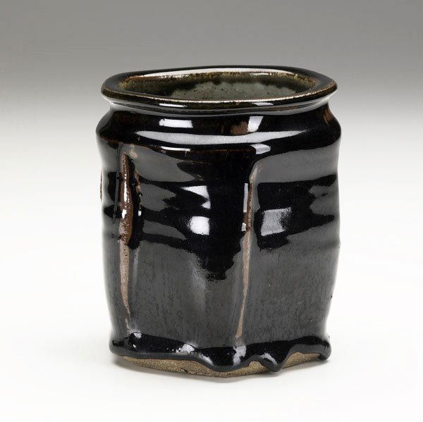 WARREN MacKENZIE Faceted vase: WARREN MacKENZIE Faceted vase covered in deep brown glaze. Signed with artist's cipher. 5'' x 4''