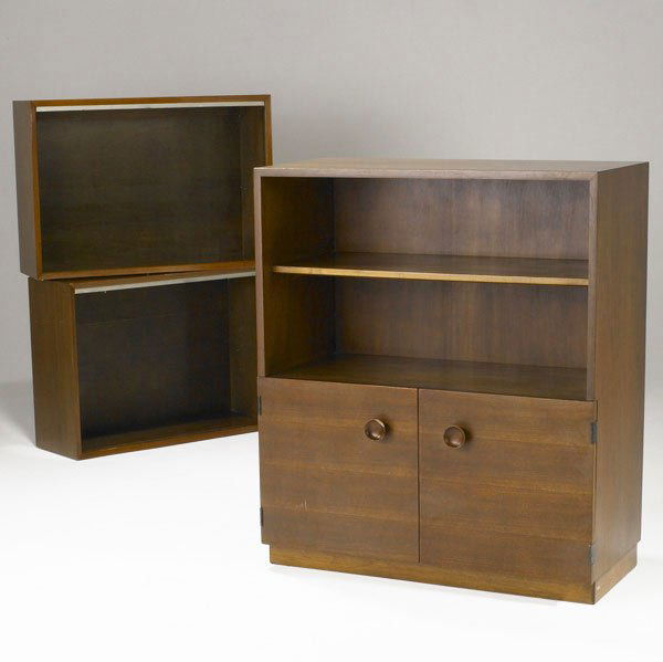 GILBERT ROHDE AND GEORGE NELSON Bookcases: GILBERT ROHDE AND GEORGE NELSON / HERMAN MILLER Two-door bookcase and two open-face bookcases in walnut. Stenciled numbers on backsides. 42 1/4'' x 36'' x 18'' and 24'' x 34'' x 12''