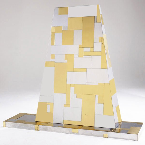 STYLE OF PAUL EVANS Fireplace hood and lower shelf: STYLE OF PAUL EVANS Fireplace hood and lower shelf in bright chrome and alternating brass panels. Hood: 60 1/2'' x 43'' x 12 1/2''; shelf: 3'' x 72'' x 18''