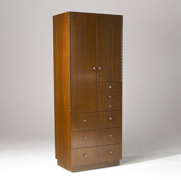 DIRECTIONAL Walnut wardrobe: DIRECTIONAL Walnut wardrobe with six drawers beneath two doors enclosing fitted drawers. 71 1/2'' x 27'' x 19''