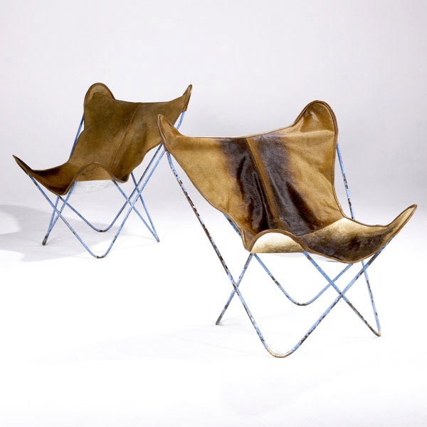 HARDOY, KURCHAN & BONET / KNOLL Butterfly chairs: HARDOY, KURCHAN & BONET / KNOLL Pair of Butterfly chairs with wrought iron frames and cowskin slings. 34 1/2'' x 33'' x 27 1/2''