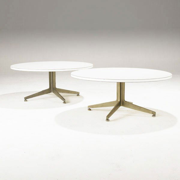 WARD BENNETT / BRICKEL Pair of coffee tables: WARD BENNETT / BRICKEL Pair of coffee tables with white architectural laminate tops on cast aluminum bases with adjustable feet. 15'' x 36'' dia.