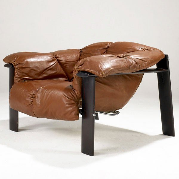 PERCIVAL LAFER (Brazil) Lounge chair.: PERCIVAL LAFER (Brazil) Lounge chair in rust-colored leather upholstery on solid rosewood base with chrome attaching hardware. 27 1/4'' x 37 1/2'' x 34 1/2''